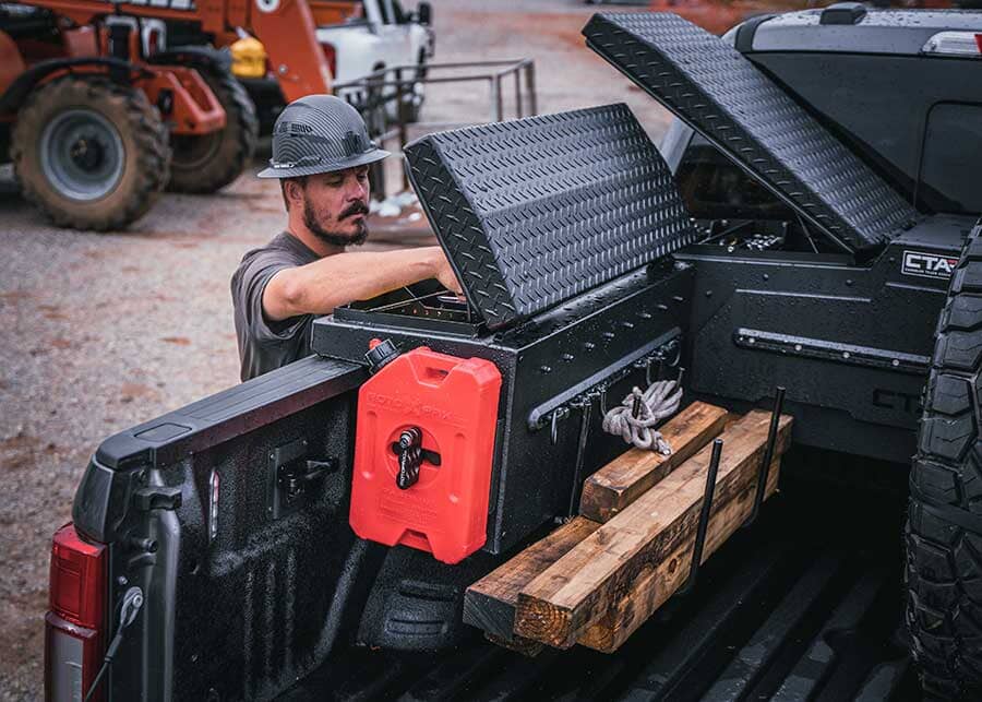 Worker opening truck side box
