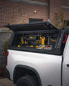 Image displaying the modular custom organization, shelving, and tool storage options of the ADAPT Truck Tool Box system and how it integrates with the ADAPT Ladder Rack