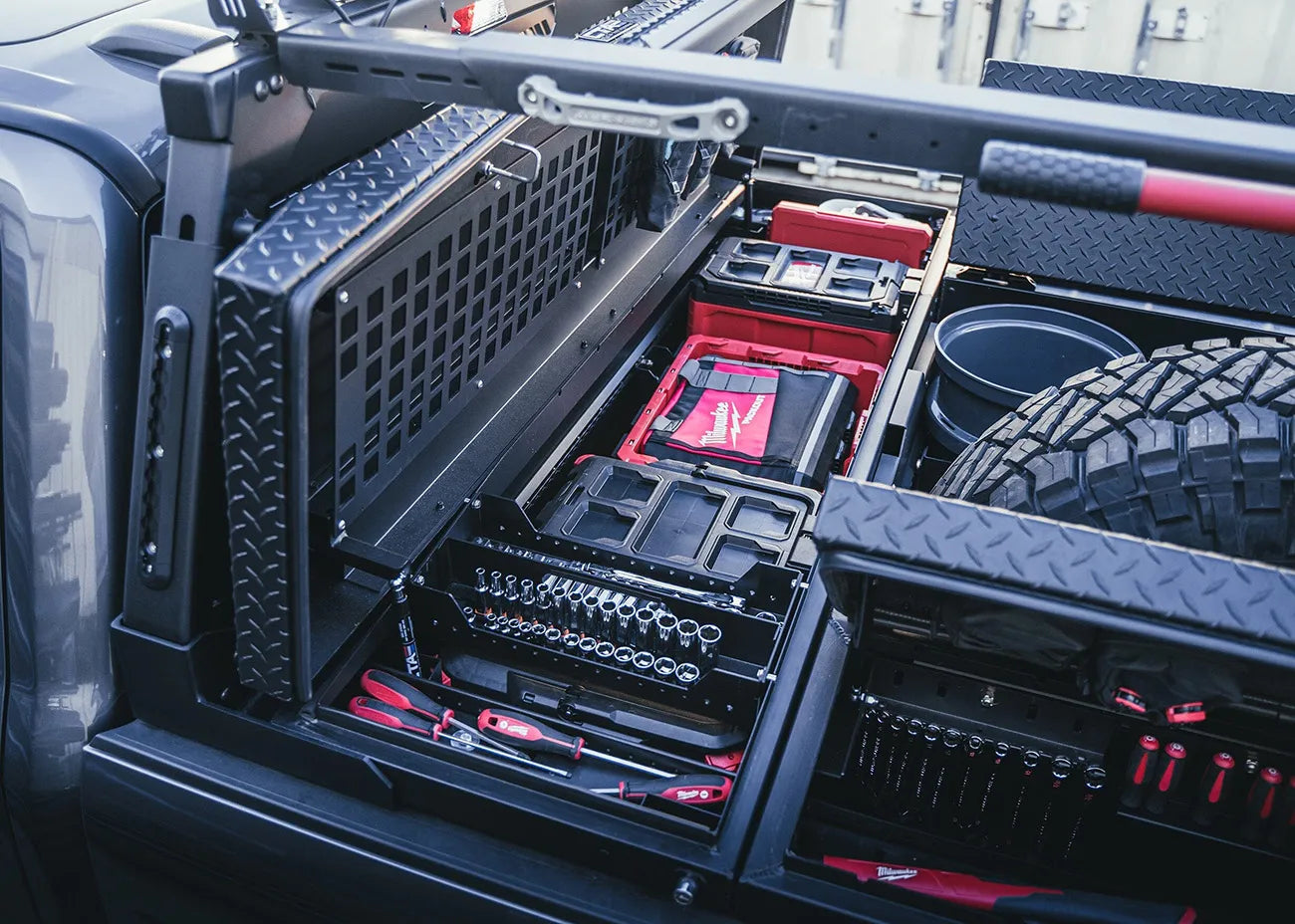 crossover truck tool box installed in a work truck with tools neatly organized inside