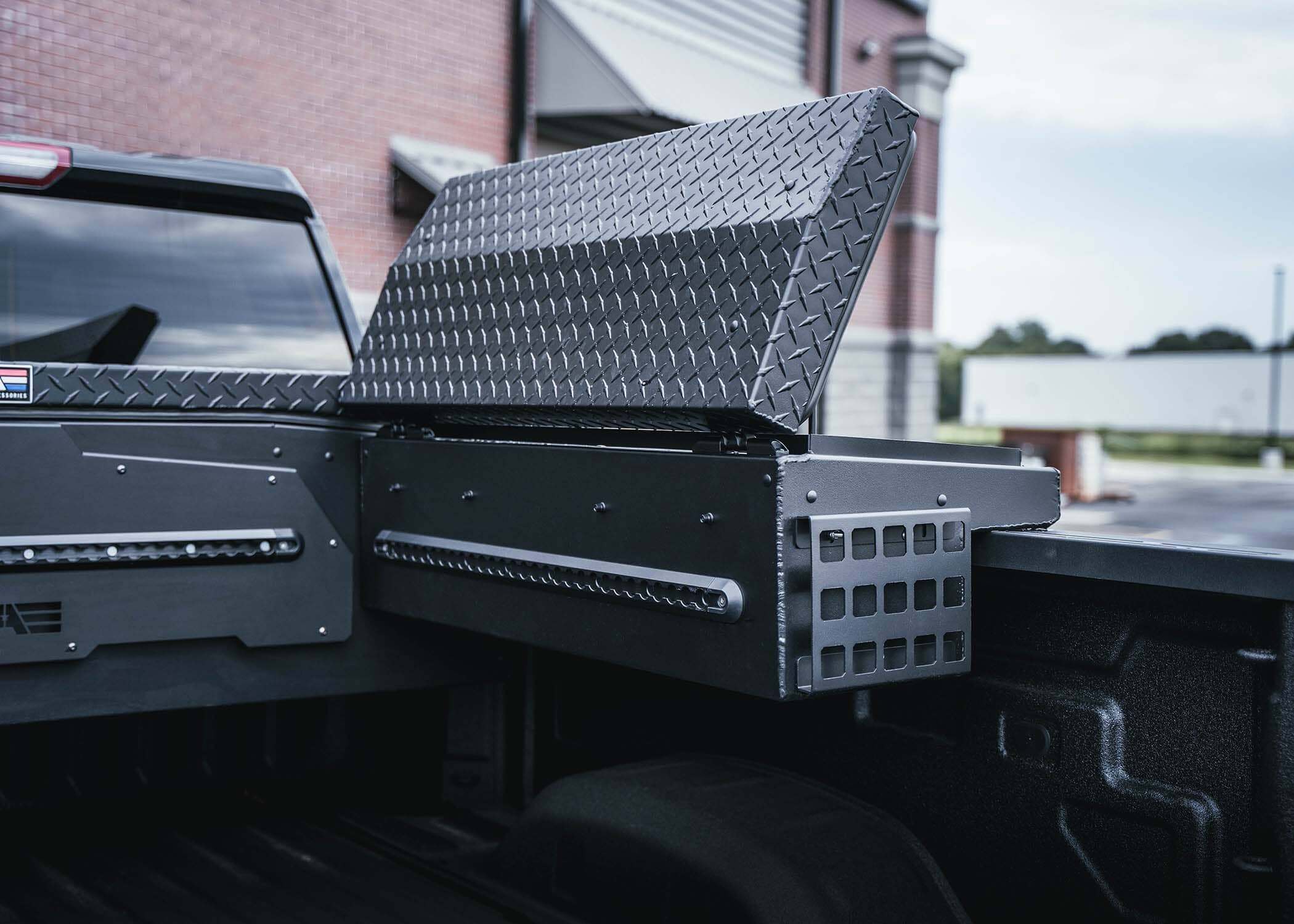  Opened Lo-Side Truck Toolbox attached to side of truck