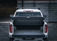 ADAPT Single Lid Truck Tool Box in black powder coat installed with truck toolbox lid closed and organized with Chandler Truck Accessories 